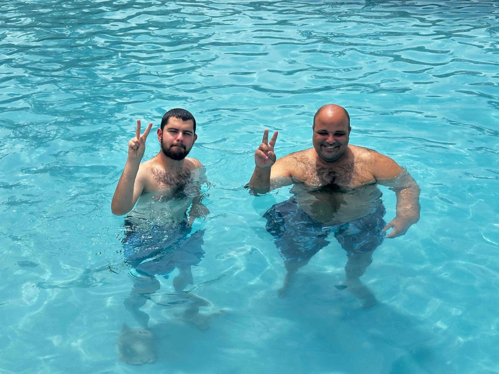 Community members enjoying time together in the pool